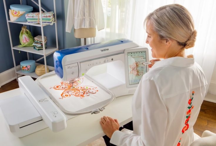 a smiling woman using a brother sewing machine